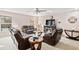 Comfortable living room featuring a cozy fireplace, ample seating, and natural light from the windows at 6210 Wescroft Ave, Castle Rock, CO 80104