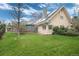 Well-manicured lawn features mature landscaping and home exterior at 4800 S Franklin St, Cherry Hills Village, CO 80113