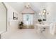 Charming bathroom featuring a vintage chandelier, pedestal sink, and large window at 4800 S Franklin St, Cherry Hills Village, CO 80113