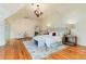 Bright bedroom features a chandelier, hardwood floors, and a patterned accent wall at 4800 S Franklin St, Cherry Hills Village, CO 80113