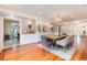 Formal dining room with beautiful hardwood floors, decorative wallpaper, and elegant chandelier at 4800 S Franklin St, Cherry Hills Village, CO 80113