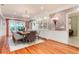 Bright dining room features hardwood floors, custom cabinets and a decorative chandelier at 4800 S Franklin St, Cherry Hills Village, CO 80113
