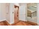 Interior shot of residential elevator with wood paneling and adjacent staircase at 4800 S Franklin St, Cherry Hills Village, CO 80113