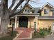 Stunning two-story home with manicured lawn, brick pathway, lush landscaping, and covered front entryway at 4800 S Franklin St, Cherry Hills Village, CO 80113