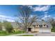 Charming two-story home with a well-manicured front yard and a circular driveway at 4800 S Franklin St, Cherry Hills Village, CO 80113