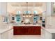 Gourmet kitchen featuring custom cabinetry, large center island, professional appliances, and bright, airy atmosphere at 4800 S Franklin St, Cherry Hills Village, CO 80113