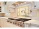 Designer kitchen with a professional-grade range and a custom tile backsplash at 4800 S Franklin St, Cherry Hills Village, CO 80113