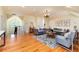 Open concept living room featuring hardwood floors, elegant furnishings, and plenty of natural light at 4800 S Franklin St, Cherry Hills Village, CO 80113