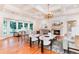 Expansive living room featuring coffered ceilings, large windows, fireplace, and hardwood flooring at 4800 S Franklin St, Cherry Hills Village, CO 80113