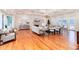 Spacious living room boasts beautiful hardwood floors, coffered ceiling, fireplace, and ample seating at 4800 S Franklin St, Cherry Hills Village, CO 80113