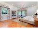 Spacious main bedroom featuring elegant decor, large windows and luxurious finishes at 4800 S Franklin St, Cherry Hills Village, CO 80113