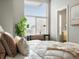 Inviting bedroom featuring a cozy bed, a window with blinds, and serene ambiance at 8855 E 55Th Ave, Denver, CO 80238