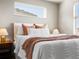Cozy bedroom featuring a plush bed, soft blankets, and stylish bedside tables at 8855 E 55Th Ave, Denver, CO 80238