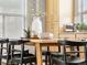 Close-up shot of dining table with flowers and decor at 8855 E 55Th Ave, Denver, CO 80238