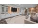 Basement featuring a built-in entertainment center with bar and hardwood floors at 1085 S Cook St, Denver, CO 80209