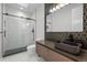 Modern bathroom featuring a walk-in shower and stylish vanity, offering a sleek and luxurious design at 1085 S Cook St, Denver, CO 80209