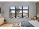 This primary bedroom offers lots of natural light and features a geometric wall design at 1085 S Cook St, Denver, CO 80209