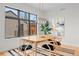 Dining area with hardwood floors and modern light fixture at 1085 S Cook St, Denver, CO 80209