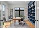 Home office with custom shelving and natural light at 1085 S Cook St, Denver, CO 80209