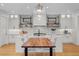 Well-appointed kitchen with large island, sleek countertops, modern appliances, and stylish decor at 1085 S Cook St, Denver, CO 80209