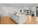 Spacious kitchen with a large island, quartz countertops, modern appliances, and open layout at 1085 S Cook St, Denver, CO 80209