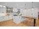 Stylish kitchen featuring custom cabinetry, stainless steel appliances, and a large center island at 1085 S Cook St, Denver, CO 80209