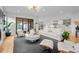 Spacious open-concept living room with modern decor and a view to the kitchen at 1085 S Cook St, Denver, CO 80209