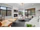Open concept living room features modern decor and access to the outdoor space at 1085 S Cook St, Denver, CO 80209