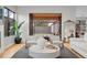 Bright living room featuring stylish furniture, a view to the backyard, and ample natural light at 1085 S Cook St, Denver, CO 80209