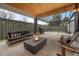 Inviting outdoor space with fire pit, grill, seating, covered patio and privacy fence, perfect for entertaining at 1085 S Cook St, Denver, CO 80209