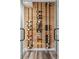Modern wine storage room with glass enclosure and built-in wall rack at 1085 S Cook St, Denver, CO 80209
