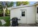 Exterior shot showing backyard area with siding, white trim and grill at 60 Vrain St, Denver, CO 80219