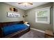 Charming bedroom with daybed, natural light, and neutral carpet offers a relaxing retreat at 60 Vrain St, Denver, CO 80219