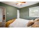 Cozy bedroom with carpet, window, fan, and closet, offering a serene and comfortable space at 60 Vrain St, Denver, CO 80219
