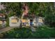Charming home with a well-maintained lawn, inviting walkway, mature shade trees, and a cozy front porch at 60 Vrain St, Denver, CO 80219