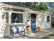 Welcoming front porch with a blue bench, colorful flower pots, and comfortable seating for relaxing outdoors at 60 Vrain St, Denver, CO 80219