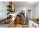 Efficient kitchen with stainless steel appliances, stylish countertops, and plenty of storage for a seamless cooking experience at 60 Vrain St, Denver, CO 80219