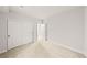 Bedroom features a large closet with sliding doors, carpeted floors, and white walls at 8777 Whiteclover St, Littleton, CO 80125