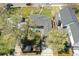 Aerial view of home with expansive lawn, mature trees, and convenient driveway access at 1624 S Elizabeth St, Denver, CO 80210