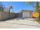 Spacious driveway and detached garage, complete with a basketball hoop for recreational activities at 1624 S Elizabeth St, Denver, CO 80210