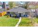 Charming home with a well-manicured lawn, mature trees, and inviting curb appeal at 1624 S Elizabeth St, Denver, CO 80210