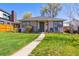 Charming single-story home with a well-manicured lawn and inviting walkway leading to the front door at 1624 S Elizabeth St, Denver, CO 80210