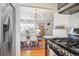 Open concept from the modern kitchen into the dining and living areas at 1624 S Elizabeth St, Denver, CO 80210