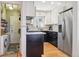 Updated kitchen with stainless steel appliances, granite countertops, and plenty of natural light at 1624 S Elizabeth St, Denver, CO 80210