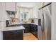 Updated kitchen with stainless steel appliances, granite countertops, and plenty of natural light at 1624 S Elizabeth St, Denver, CO 80210
