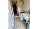Practical laundry room features a washing machine, sink, and durable wood-look flooring at 1624 S Elizabeth St, Denver, CO 80210