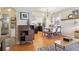Open-concept living room and dining area with hardwood floors and view of the kitchen at 1624 S Elizabeth St, Denver, CO 80210