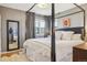 Beautifully decorated main bedroom with a four-poster bed, soft lighting, and ample space at 1624 S Elizabeth St, Denver, CO 80210