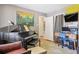 Multi-purpose room with a piano, desk, and ample natural light at 1624 S Elizabeth St, Denver, CO 80210