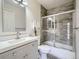 Bathroom with a shower, a tub, and a modern vanity at 6332 Zang Court # A, Arvada, CO 80004